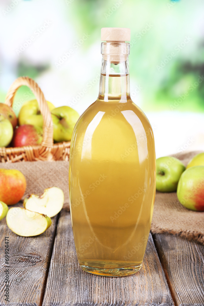 Apple cider vinegar in glass bottle and ripe fresh apples, Apple cider vinegar in glass bottle and ripe fresh apples,
