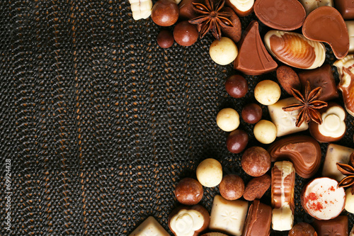 Different kinds of chocolates on dark background