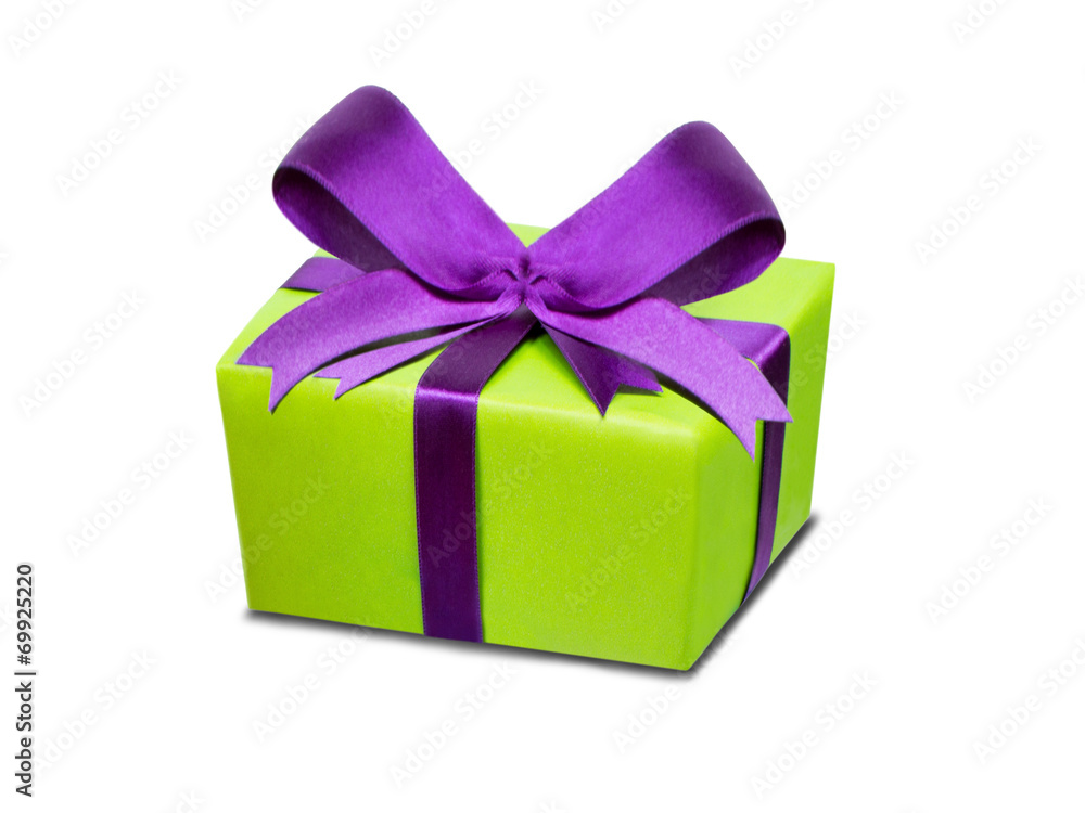Geschenk mit großer Schleife vor weißem Hintergrund Geschenk mit großer Schleife vor weißem Hintergrund
