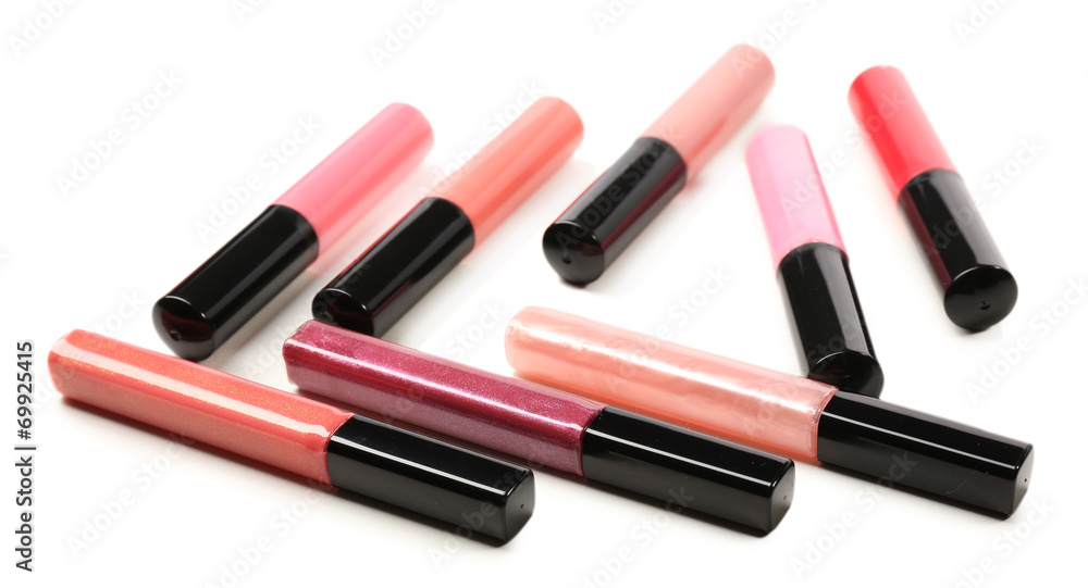 Beautiful lip glosses, isolated on white Beautiful lip glosses, isolated on white