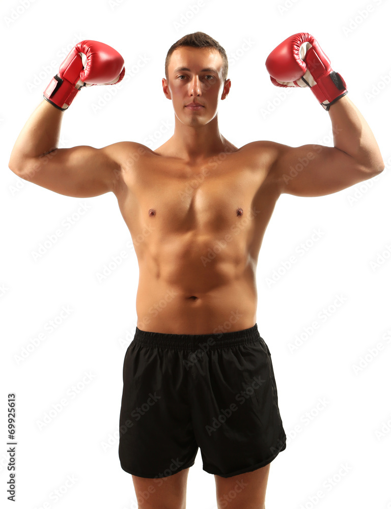 Handsome young muscular sportsman with boxing gloves isolated