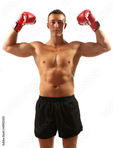Handsome young muscular sportsman with boxing gloves isolated © Africa Studio