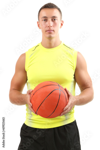 Handsome young sportsman holding ball isolated on white