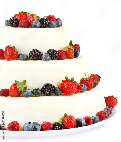 Beautiful wedding cake with berries  isolated on white