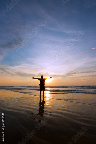 Silhouette of a man at sunset