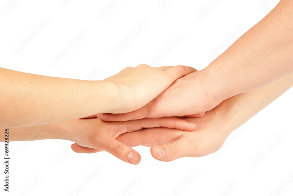 Hands on top of each other. Symbolic picture. Hands on top of each other. Symbolic picture.