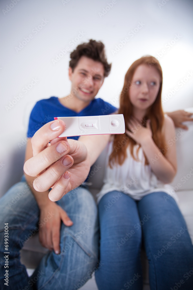 Happy couple with positive pregnancy test Happy couple with positive pregnancy test