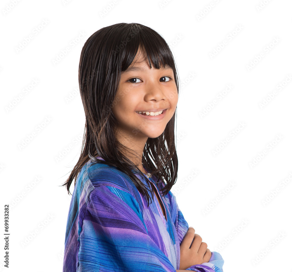 Young preteen Asian girl in Malay traditional dress baju kurung Young preteen Asian girl in Malay traditional dress baju kurung