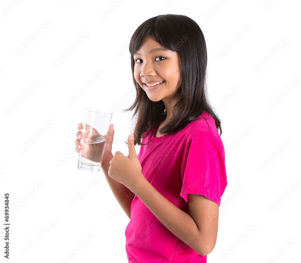 Young Asian preteen with a glass of water over white background Young Asian preteen with a glass of water over white background