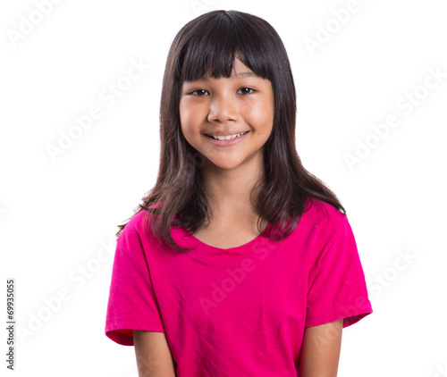Young Asian preteen girl in pink t-shirt over white background
