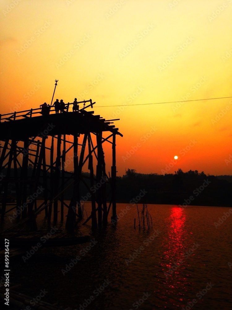 The silhouette of old wooden bridge kanchanaburi Thailand