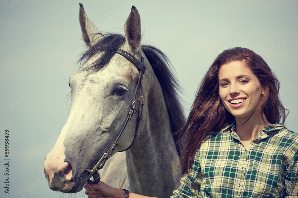 Woman with a white horse  outdoor