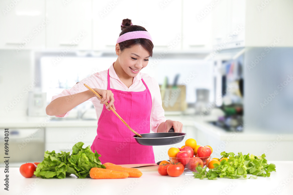 Happy smiling woman in kitchen