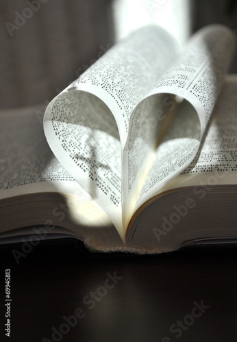 God is love, open book with heart shaped pages