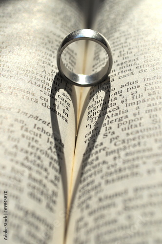 Ring casting a heart-shaped shadow in a book