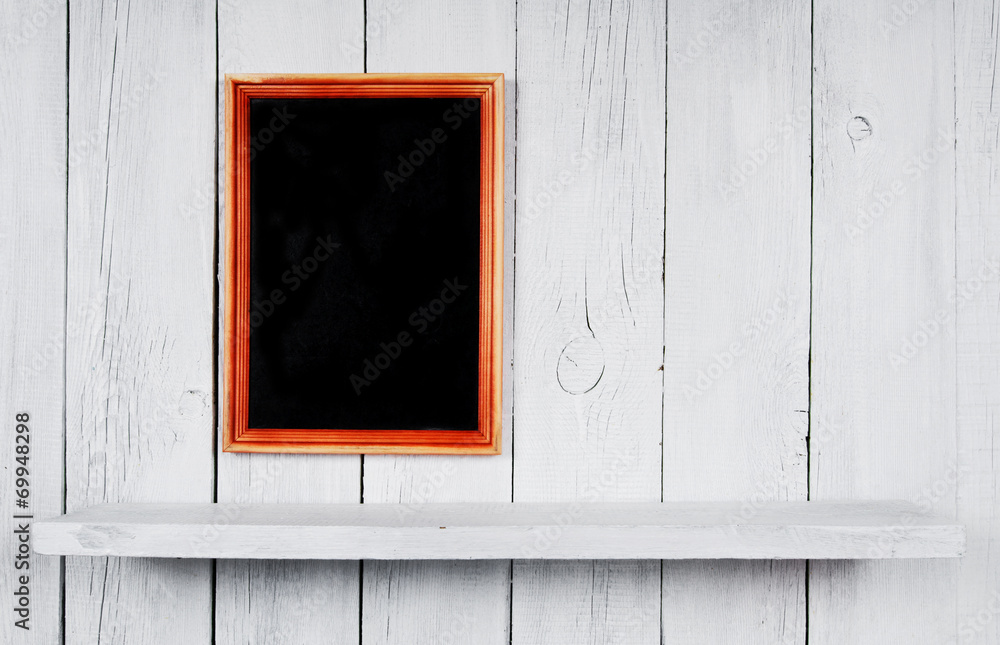 Back to school. Frame and wooden shelf.