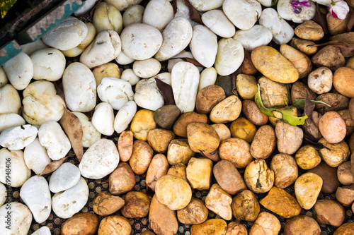 A bunch of round sea pebbles isolated on white background
