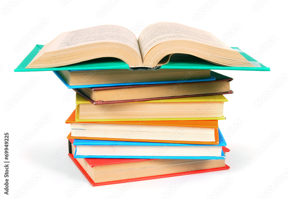 The open book on a pile of multi-coloured books. The open book on a pile of multi-coloured books.
