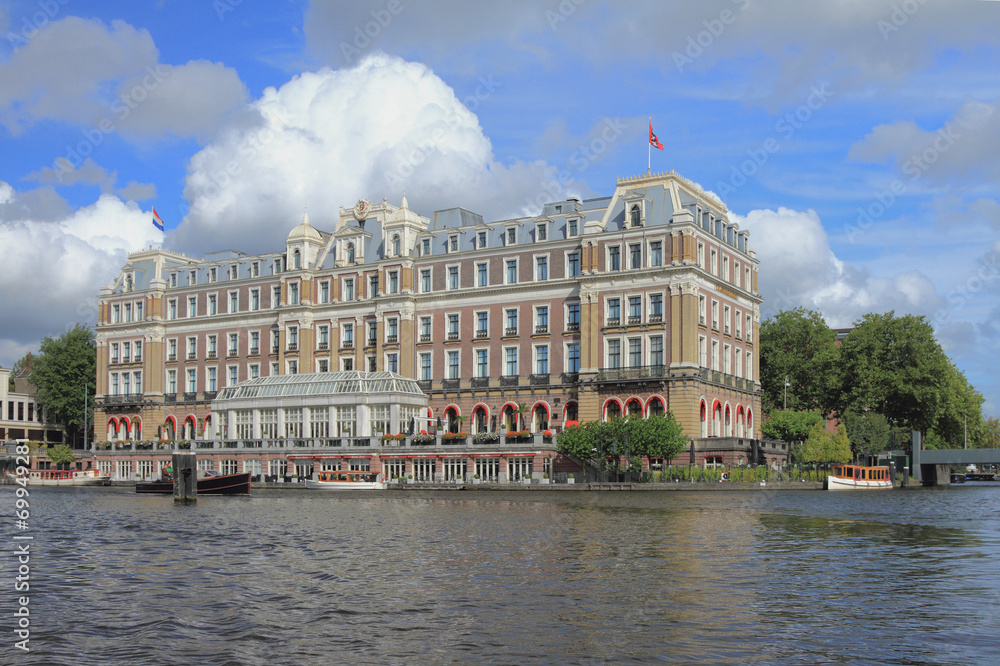 Ancient building on river bank. Amsterdam, Holland Ancient building on river bank. Amsterdam, Holland