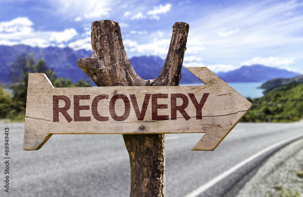 Recovery wooden sign with a road background