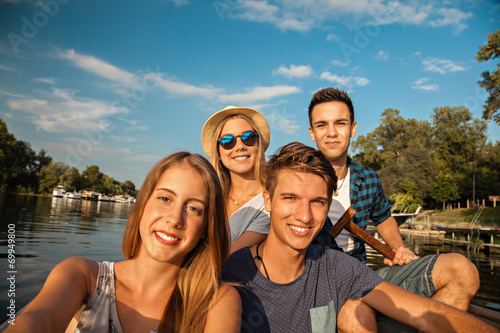 Cheerful Friends Taking Selfie On A Boat © Dangubic