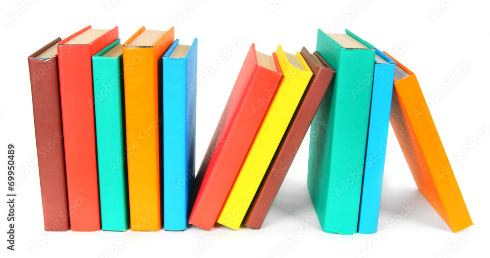 Multi-coloured books. On white background. Multi-coloured books. On white background.