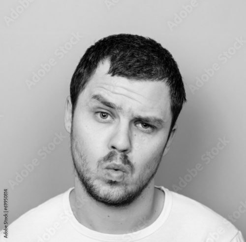 Portrait of man with funny face - Monocrome or black and white p