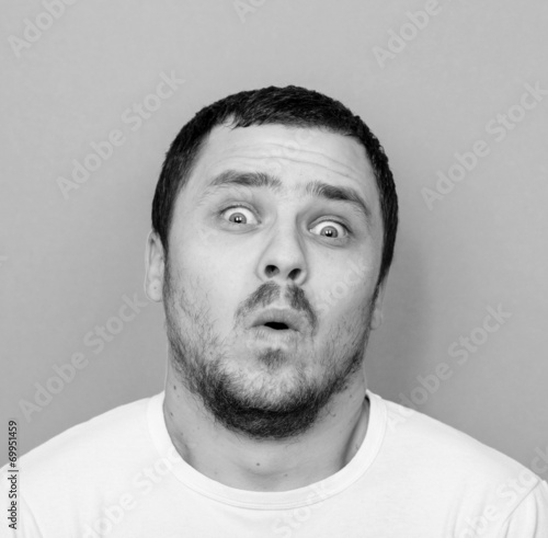 Portrait of man with funny face - Monocrome or black and white p