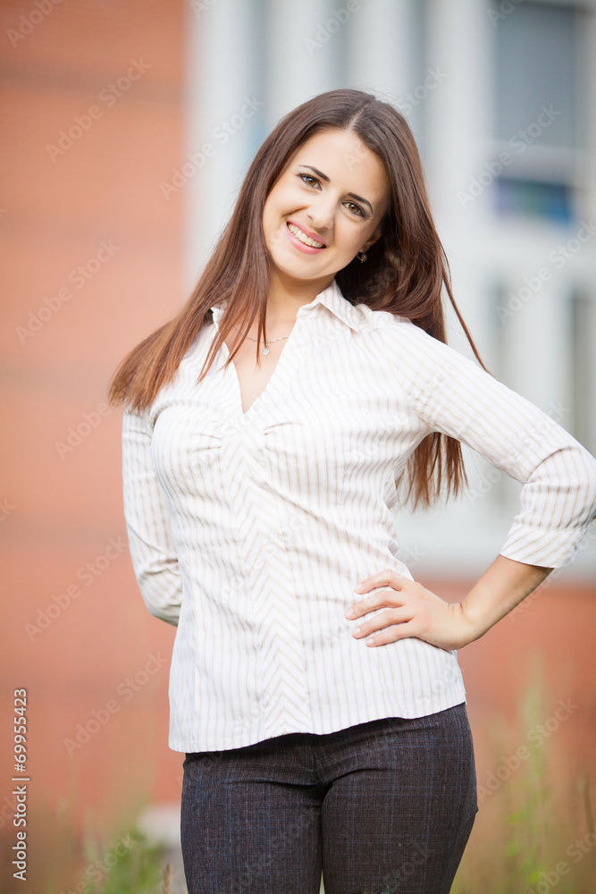 Beautiful business woman on the background of the modern office Beautiful business woman on the background of the modern office