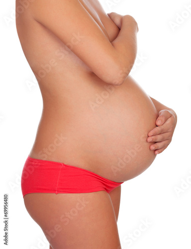Delicate pose of a pregnant woman with naked torso © Gelpi