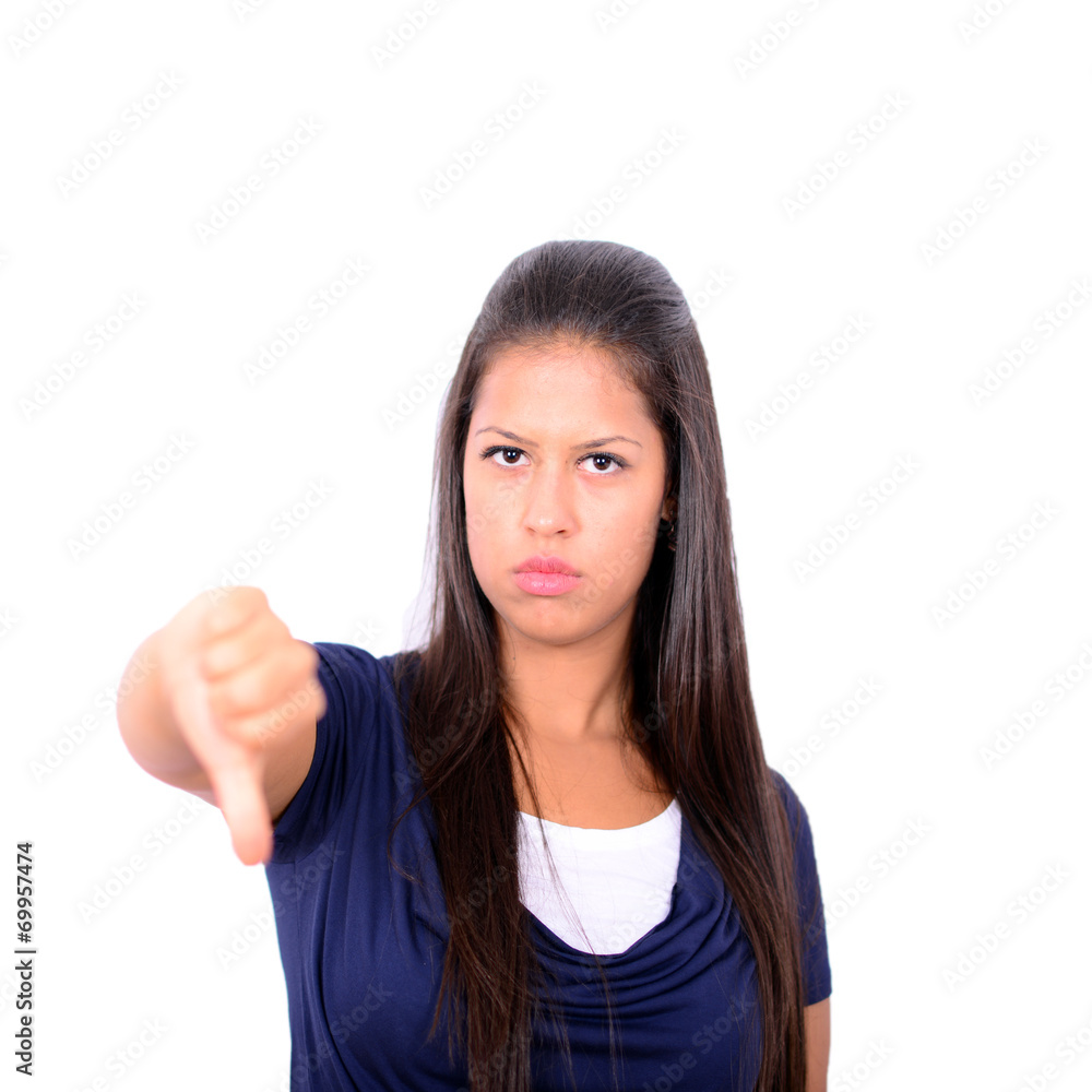 Young woman thumbing down isolated on white background Young woman thumbing down isolated on white background