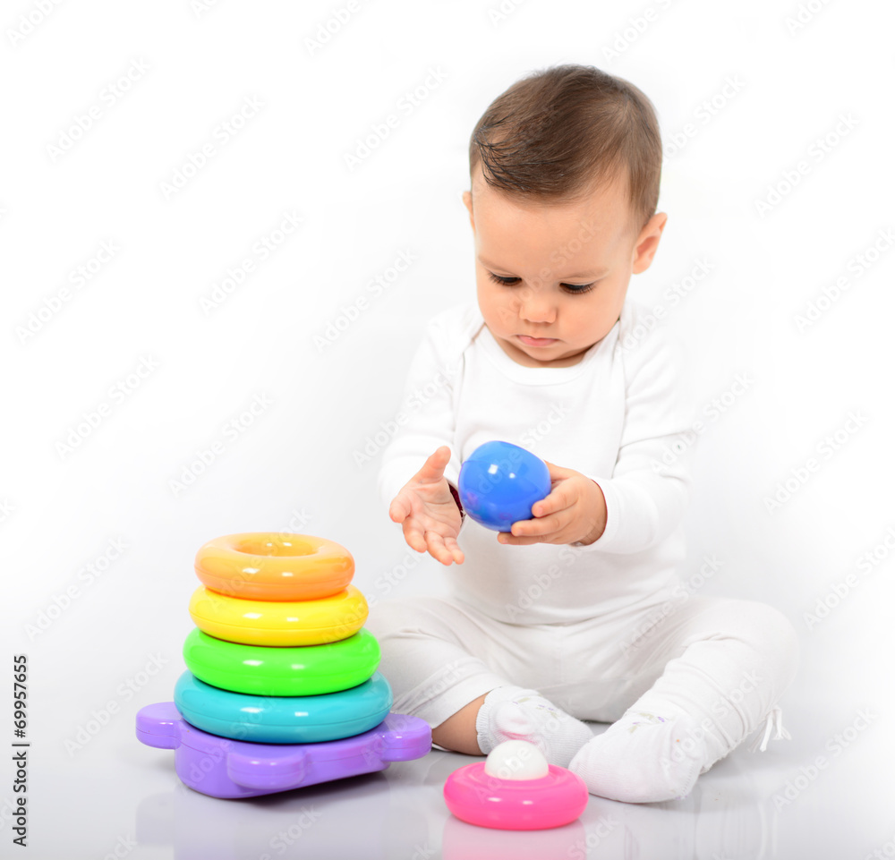 Beautiful baby girl with colorful toys - Studio shot Beautiful baby girl with colorful toys - Studio shot