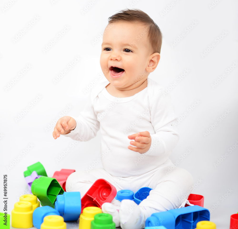 Beautiful baby girl with colorful toys - Studio shot Beautiful baby girl with colorful toys - Studio shot