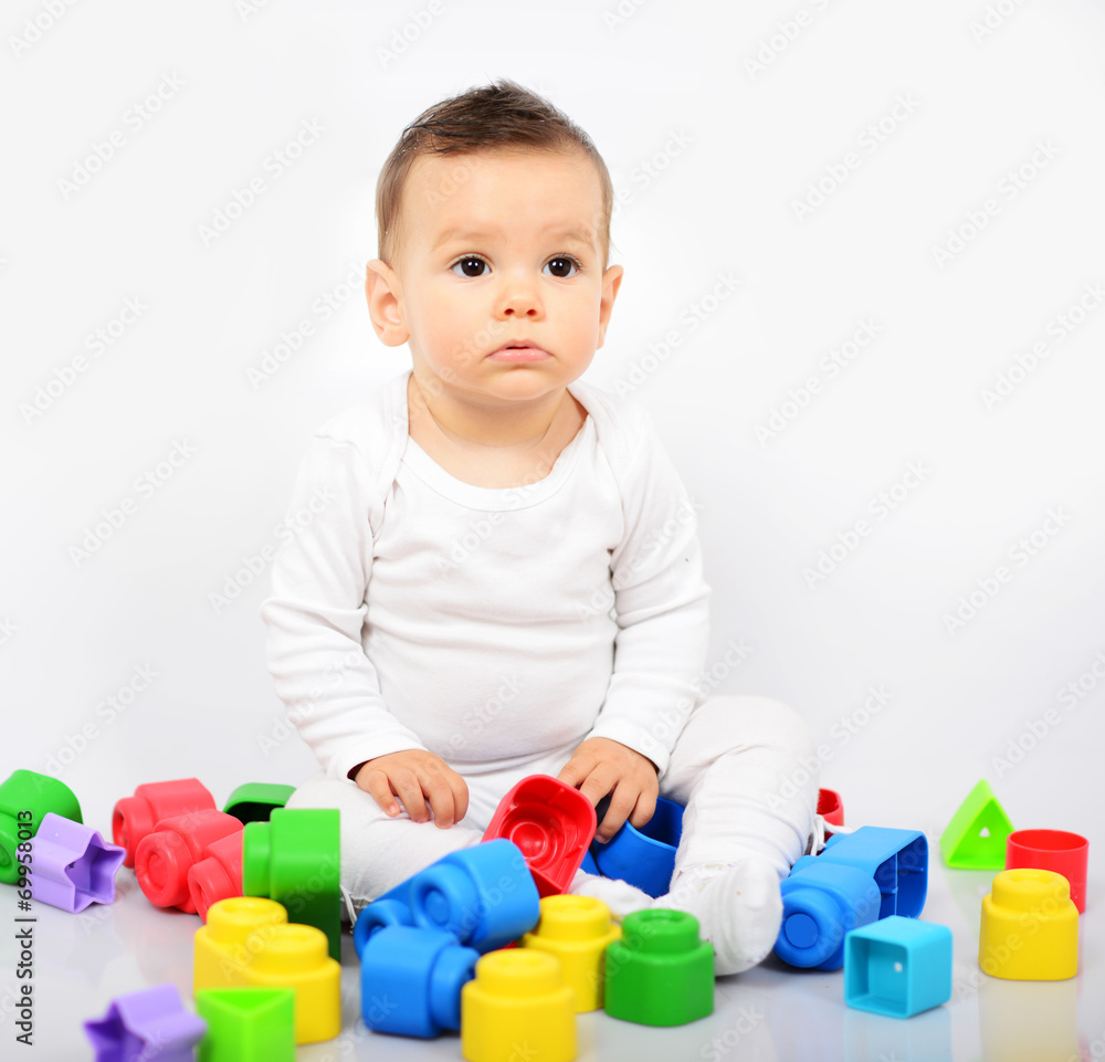Beautiful baby girl with colorful toys - Studio shot Beautiful baby girl with colorful toys - Studio shot