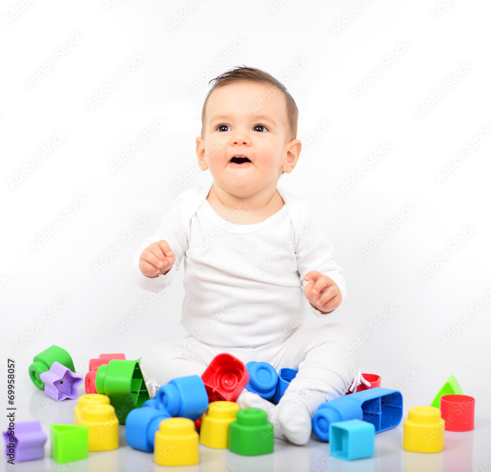 Beautiful baby girl with colorful toys - Studio shot Beautiful baby girl with colorful toys - Studio shot