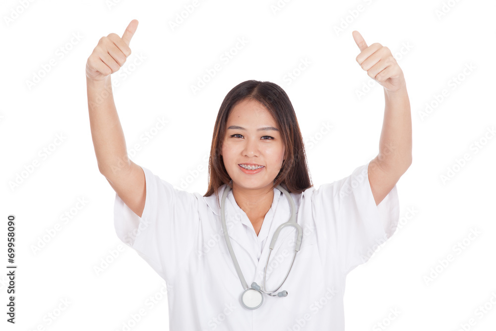 Young Asian female doctor show two thumbs up Young Asian female doctor show two thumbs up
