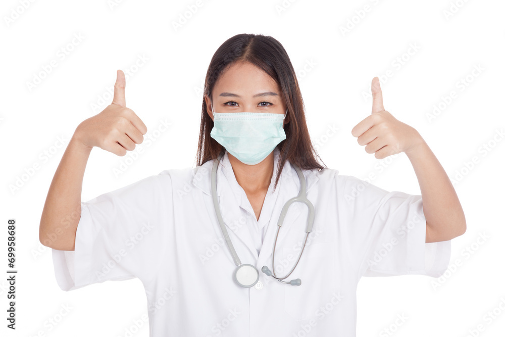 Young Asian female doctor thumbs up with both hands Young Asian female doctor thumbs up with both hands