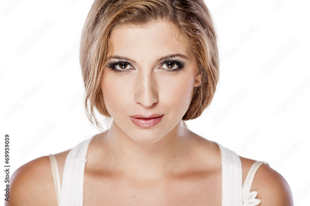 Headshot of serious girl on white background Headshot of serious girl on white background