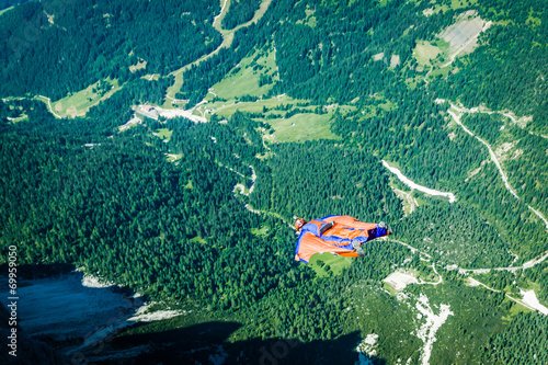 Obraz na płótnie BASE jumper jumping off a big cliff in Dolomites,Italy, breathta w salonie