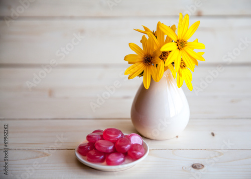 yellow flowers in a vintage vase
