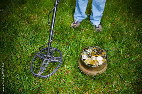 pot of golden coins collected with help of metal detector