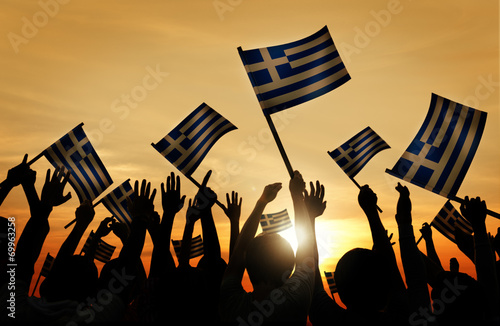 People Holding Flag of Greece Back Lit