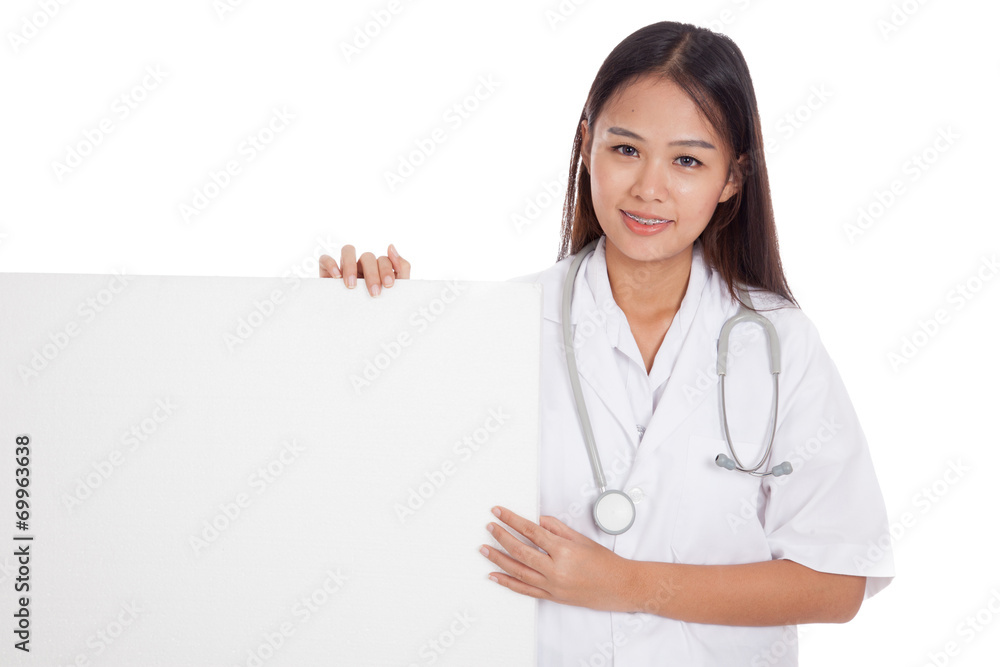 Young Asian female doctor hold a blank sign Young Asian female doctor hold a blank sign