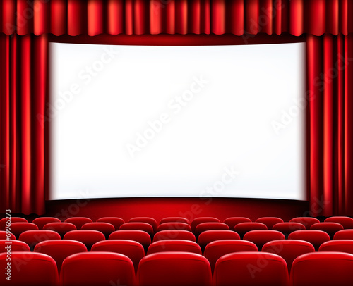 Rows of red cinema or theater seats in front of white blank scre