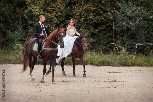 wedding couple on horses © alkiona_25