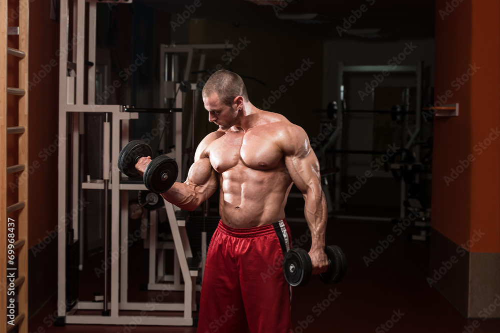 Male Bodybuilder Doing Heavy Weight Exercise For Biceps Male Bodybuilder Doing Heavy Weight Exercise For Biceps