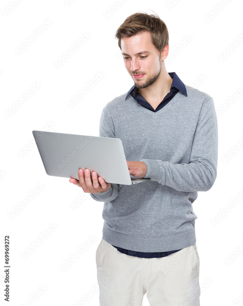 Caucasian man use of laptop computer Caucasian man use of laptop computer
