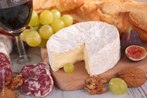 cheese with grape, sausage and wine