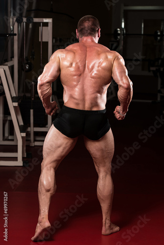 Bodybuilder Performing Rear Lat Spread Pose