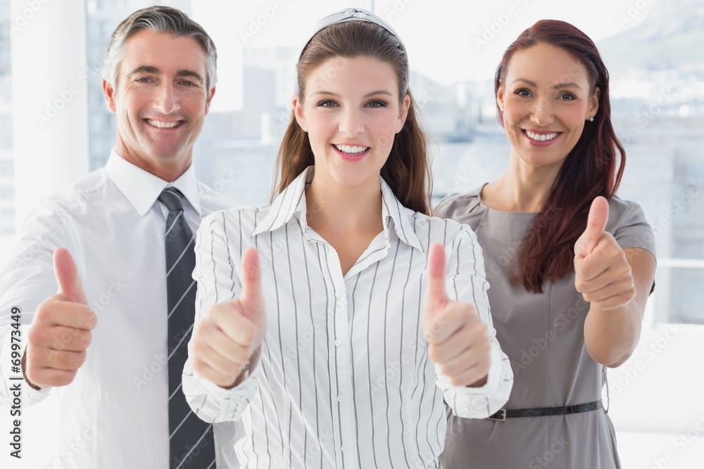 Smiling businesswoman giving thumbs up Smiling businesswoman giving thumbs up